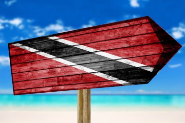Trinidad ve Tobago bayrak ahşap plaj arka plan üzerinde oturum