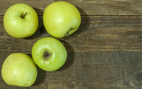 Green apples on wooden background — Stock Photo, Image