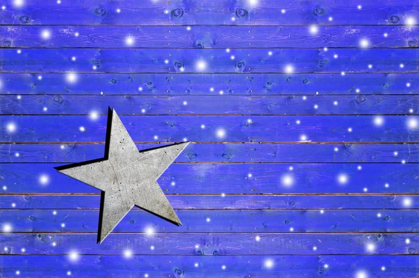 Star on weathered blue wooden board — Stock Photo, Image