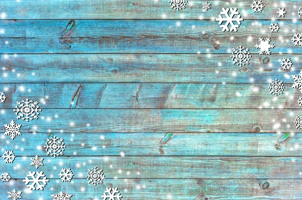 Χριστούγεννα φόντο με νιφάδες χιονιού και ξύλινα υφή — Φωτογραφία Αρχείου