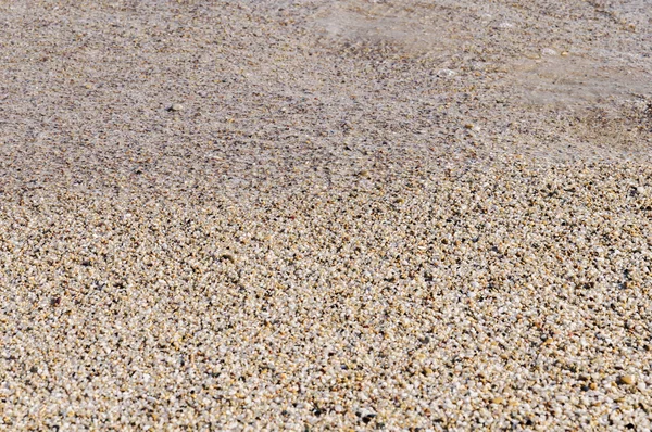 Naturally rounded gravel at sea shore, nature sea background texture — Stock Photo, Image