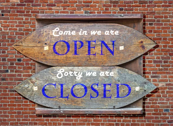 Wooden signs - Blue Open and Closed hanged on brick wall — Stock Photo, Image