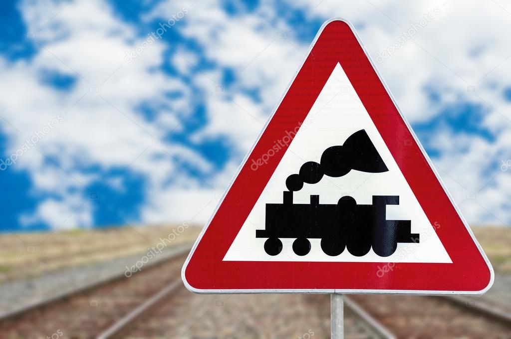 Railroad Level Crossing Sign Without Barrier Or Gate Ahead The Road With Cloudy Blue Sky Stock Photo By C Bennian