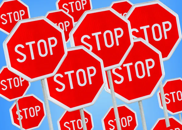 Stop sign against blue background — Stock Photo, Image