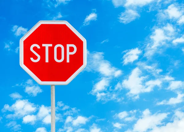 Stop sign against blue sky background — Stock Photo, Image