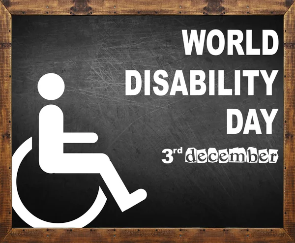 Światowy dzień osób niepełnosprawnych napisał na tablicy — Zdjęcie stockowe