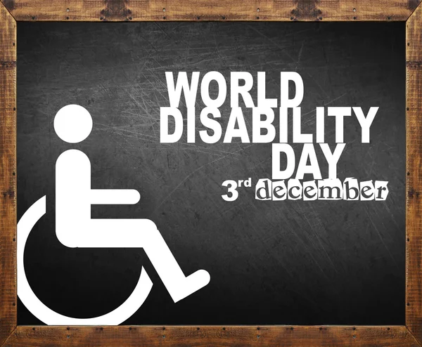 Światowy dzień osób niepełnosprawnych napisał na tablicy — Zdjęcie stockowe