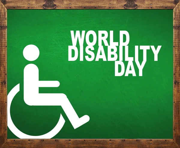 Światowy dzień osób niepełnosprawnych napisał na tablicy zielony — Zdjęcie stockowe
