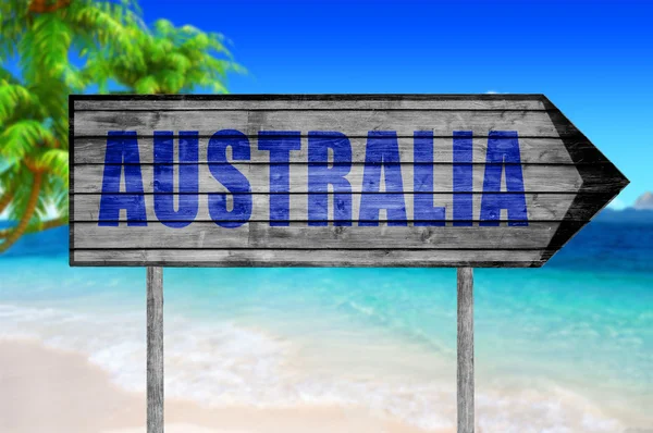 Australsk treskilt med strandbakgrunn – stockfoto