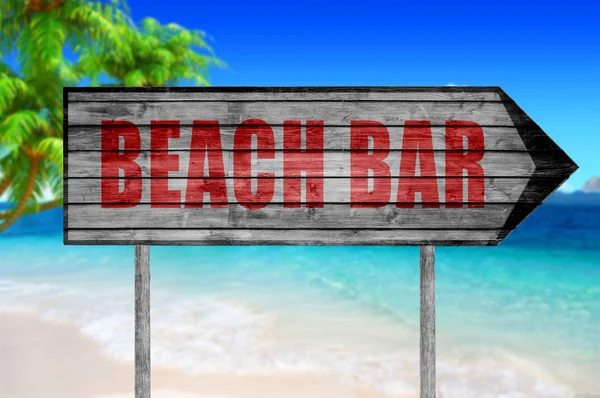 Red Beach Bar träskylt med på stranden bakgrund — Stockfoto