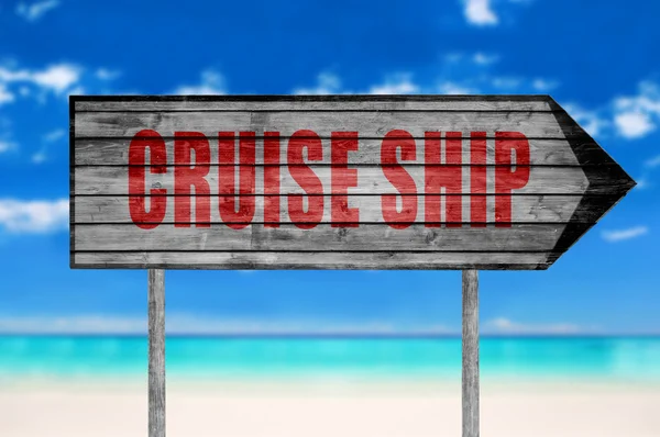 Red Cruise Ship segno di legno con su uno sfondo spiaggia — Foto Stock