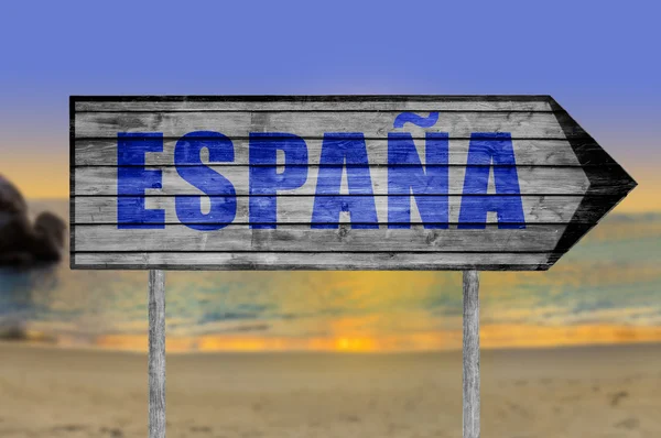 Hiszpania (w języku hiszpańskim) drewniany znak z plaży tło — Zdjęcie stockowe