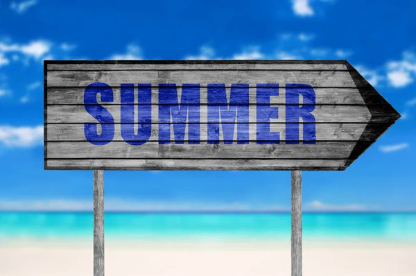 Summer wooden sign with on a beach background — Stock Photo, Image