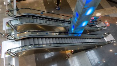 metal stairs with no one using them in a shopping mall without people shortly after opening its doors