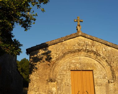 granitica stone church cover with a cross on the vertice of the fronton