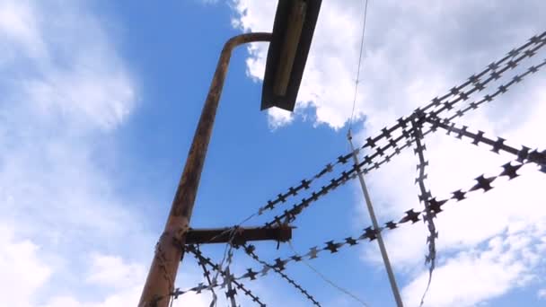 Barbed wire over the fence of the prison — Stock Video