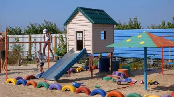 Stepanovka. Ukraine. July 16, 2015. Children play on the playground — Stock Video