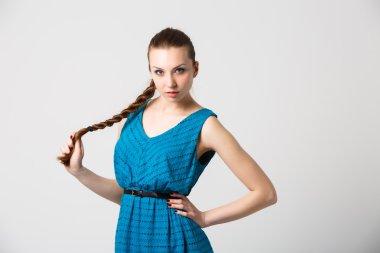 Portrait of beautiful girl with perfect long shiny blond hair studio shot