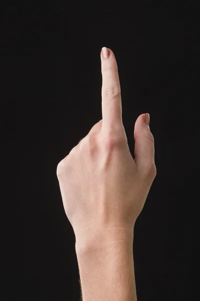 Finger on a touchscreen isolated with dark background — 图库照片