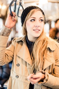 blonde woman in the tram