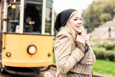 Woman waiting for the tram