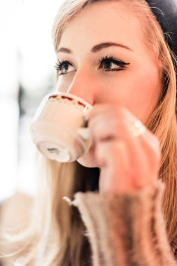 Woman drinking drinking coffee