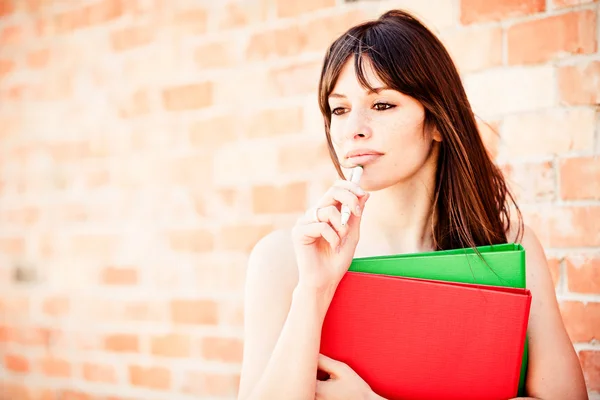 Young woman with folders — Stock Photo, Image