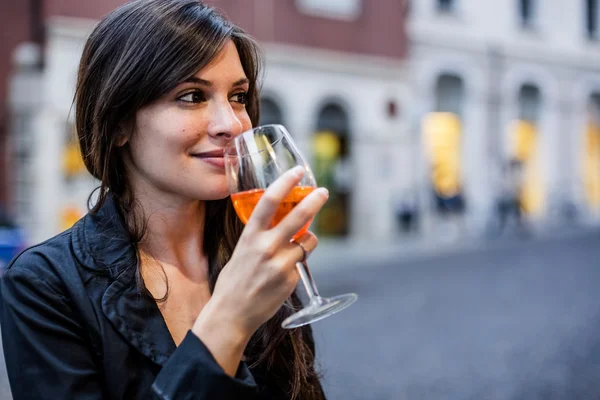 Woman drinking an aperitif — Stock Photo, Image
