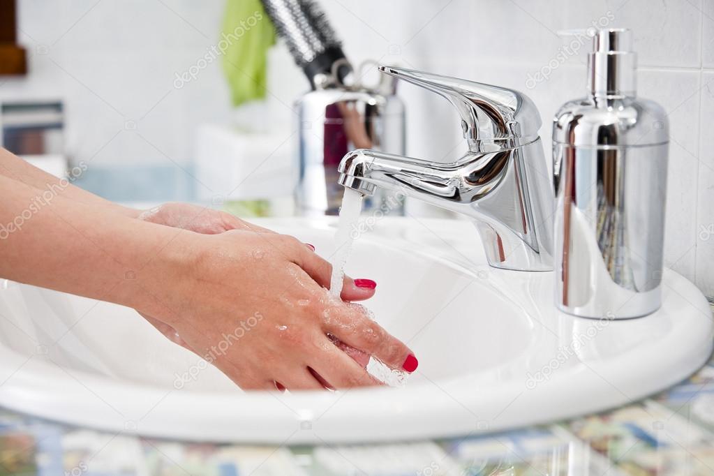 Woman washing hands