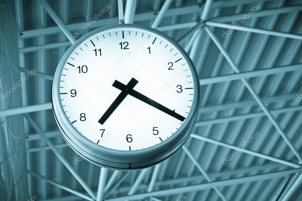 metallic clock shows the time