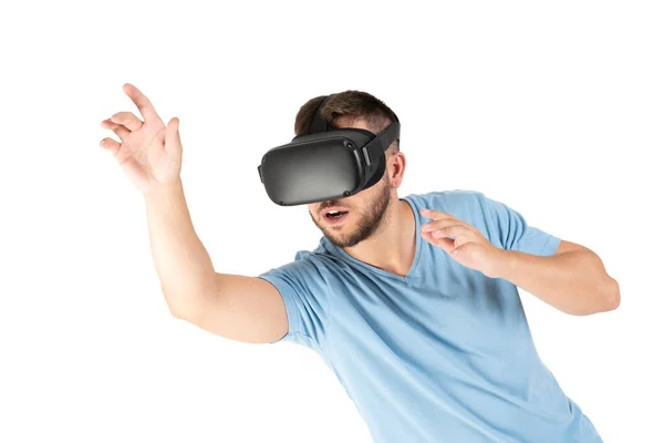 Young man playing with a VR glasses on a white background — Stock Photo, Image