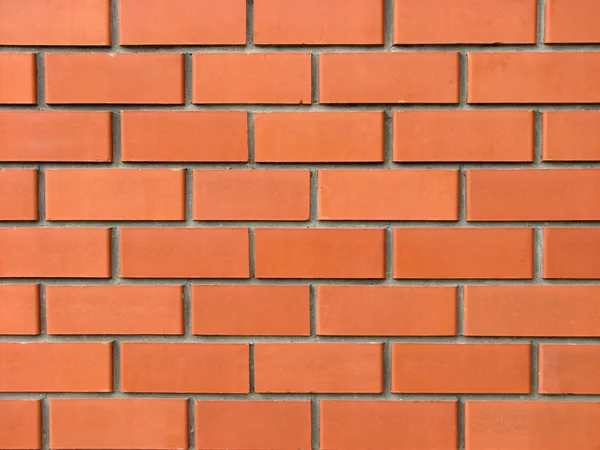 Nowym murem z czerwonej cegły — Zdjęcie stockowe