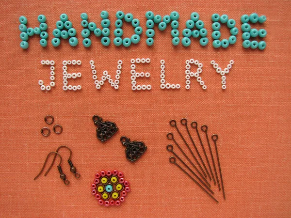 Inscription made of beads, handmade jewelry, furniture and tools