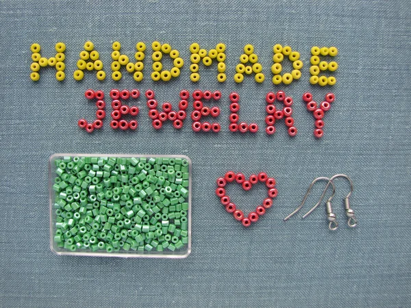 Inscription made of beads, handmade jewelry, furniture and tools