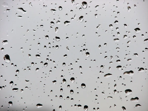Gotas de lluvia en vidrio de ventana —  Fotos de Stock