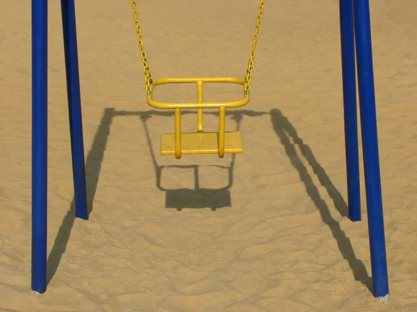 The swings at the playground — Zdjęcie stockowe