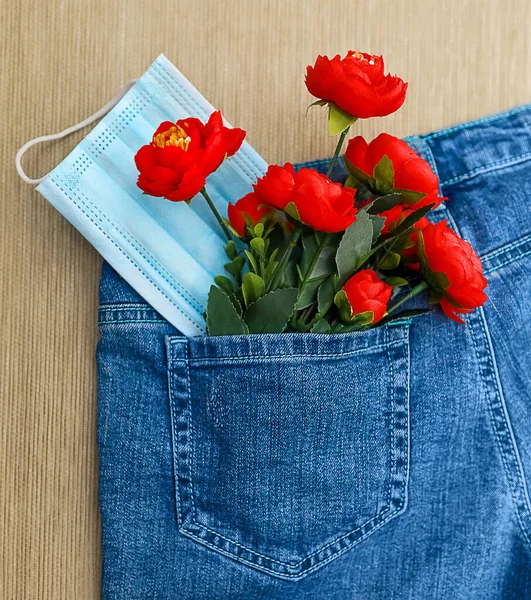 Bouquet Red Flowers Medical Mask Jeans Pocket Top View Close — Stock Photo, Image