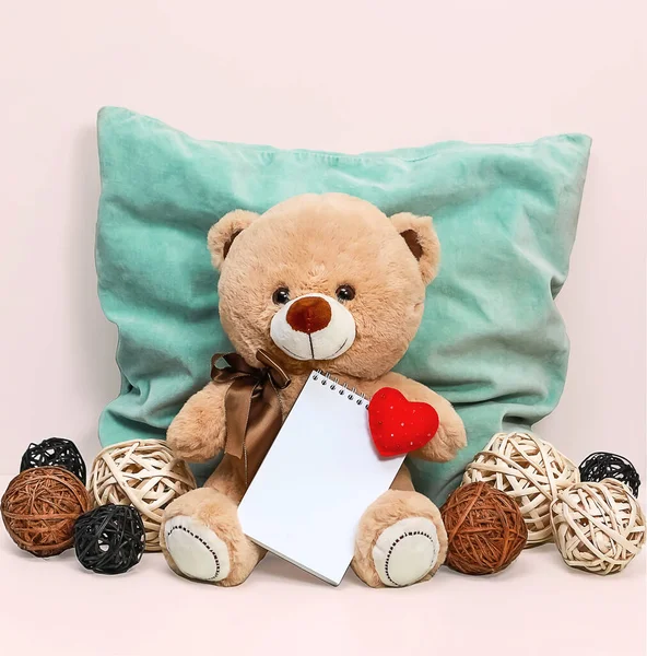 Teddy Bear Holding Notepad Soft Heart Background Blue Pillow Wicker — Stock Photo, Image