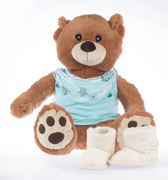 Teddy beer met blauwe shirt en lint, geïsoleerd — Stockfoto