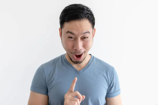 Surprised and wow face of man in blue t-shirt on isolated background. — Stock Photo, Image