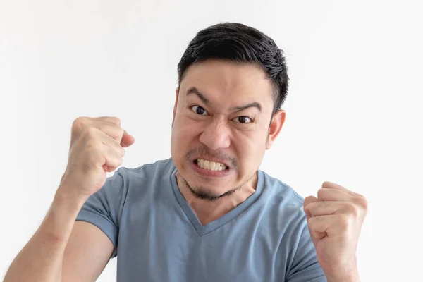 Angry and mad face of man in blue t-shirt on isolated background. — Stock Photo, Image
