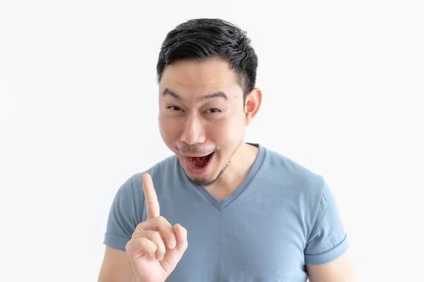 Surprised and wow face of man in blue t-shirt on isolated background. — Stock Photo, Image