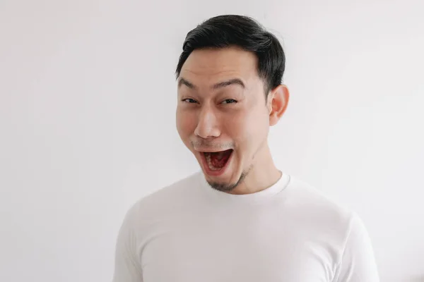 Funny grin smile face of man in white t-shirt isolated on white wall. — Stock Photo, Image