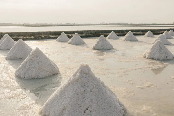 Close up of salt piles in salt farm from sea water.