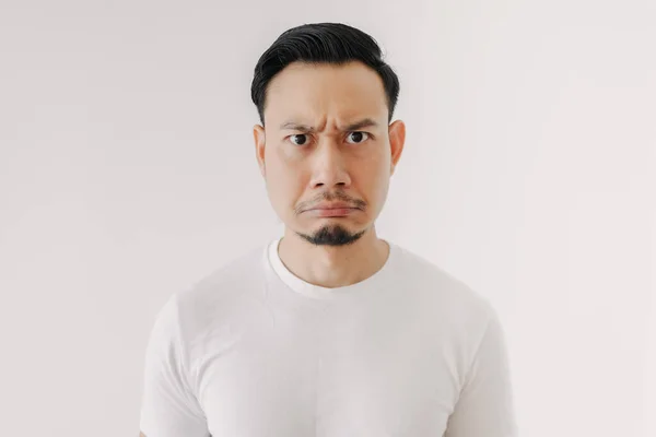 Grumpy face man in white t-shirt isolated on white background. — Stock Photo, Image