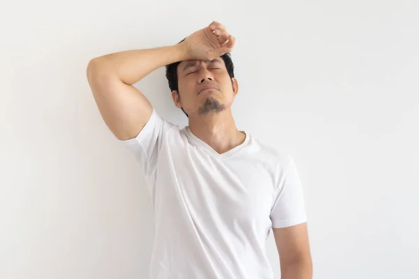 Serious and upset man wears white t-shirt isolated on white background. — Stock Photo, Image