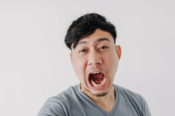 Funny face of man yawning isolated on white background. — Stock Photo, Image