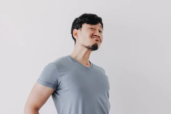 Insolent denying face of man in blue t-shirt isolated on white background. — Stock Photo, Image