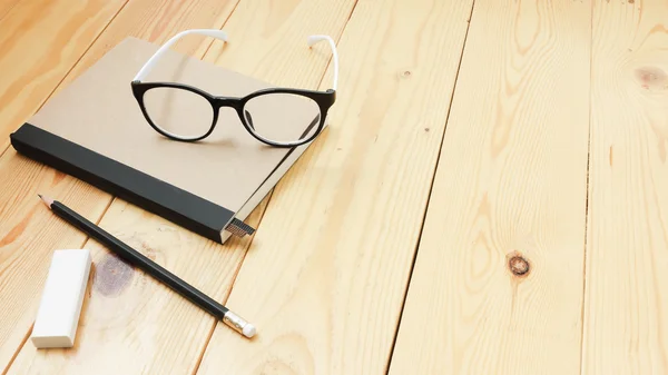 Loft workspace with stationaries on wooden table. — Stock Photo, Image