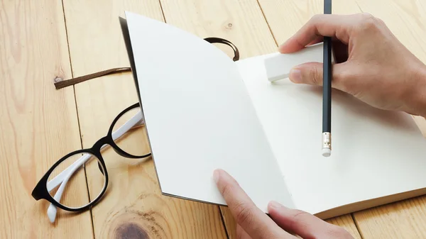 Loft workspace with stationaries on wooden table. Stock Photo